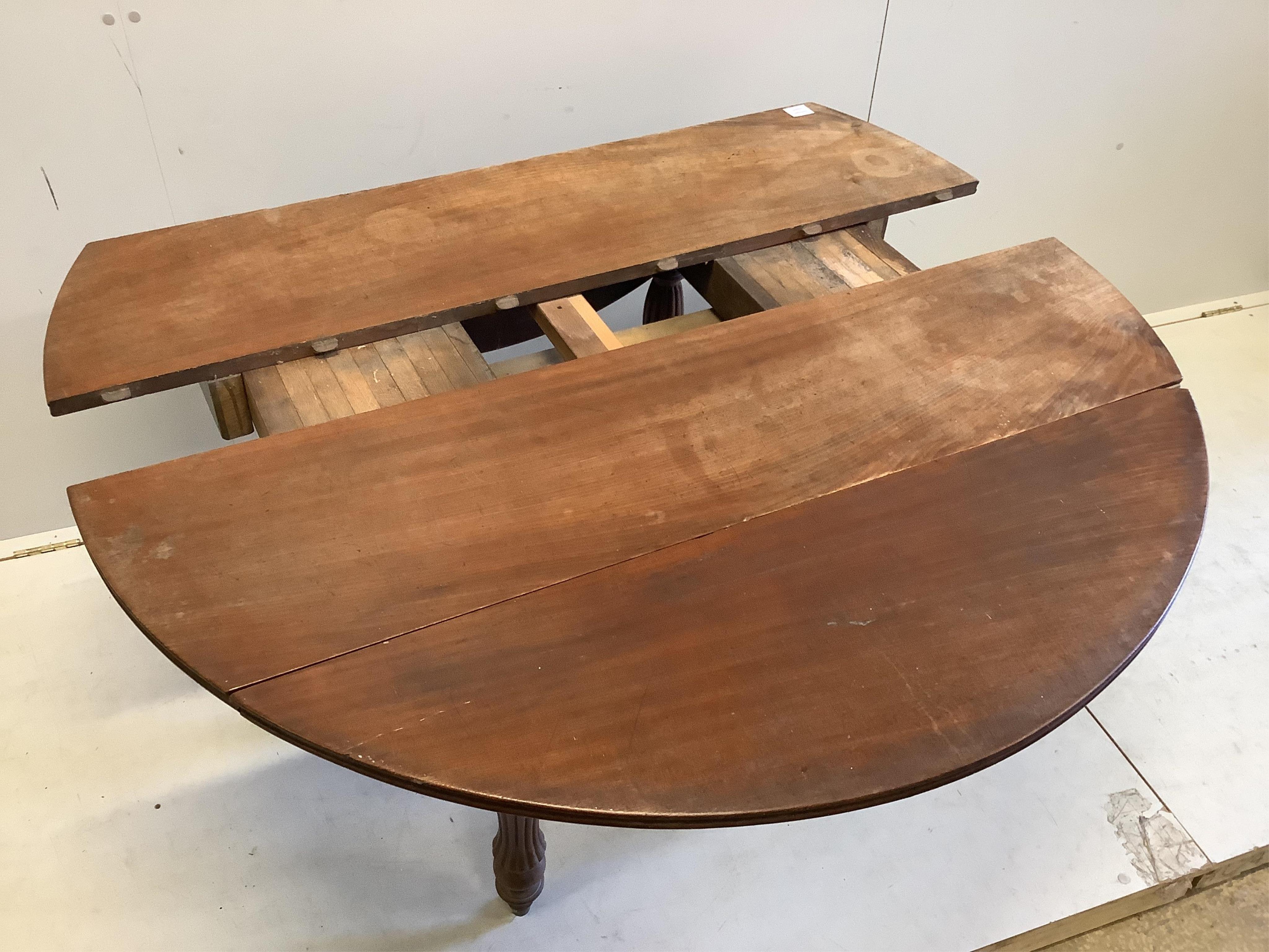 A 19th century Continental mahogany drop leaf extending dining table, no leaves, width 166cm extended, depth 129cm, height 68cm